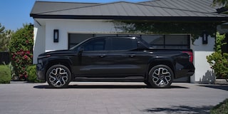 Side-Profile View Of The 2024 Silverado EV Parked In A Driveway