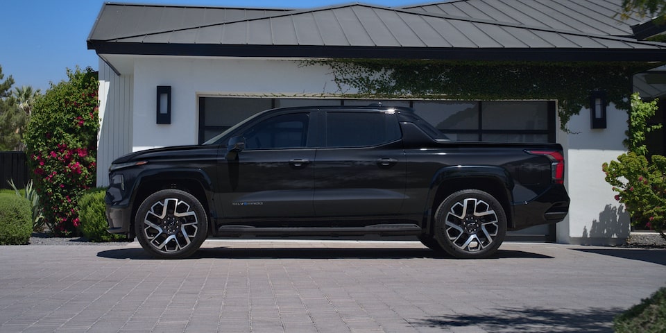 Side-Profile View Of The 2024 Silverado EV Parked In A Driveway