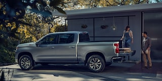 Couple Loading Supplies Into the Back of a Chevrolet Silverado 1500