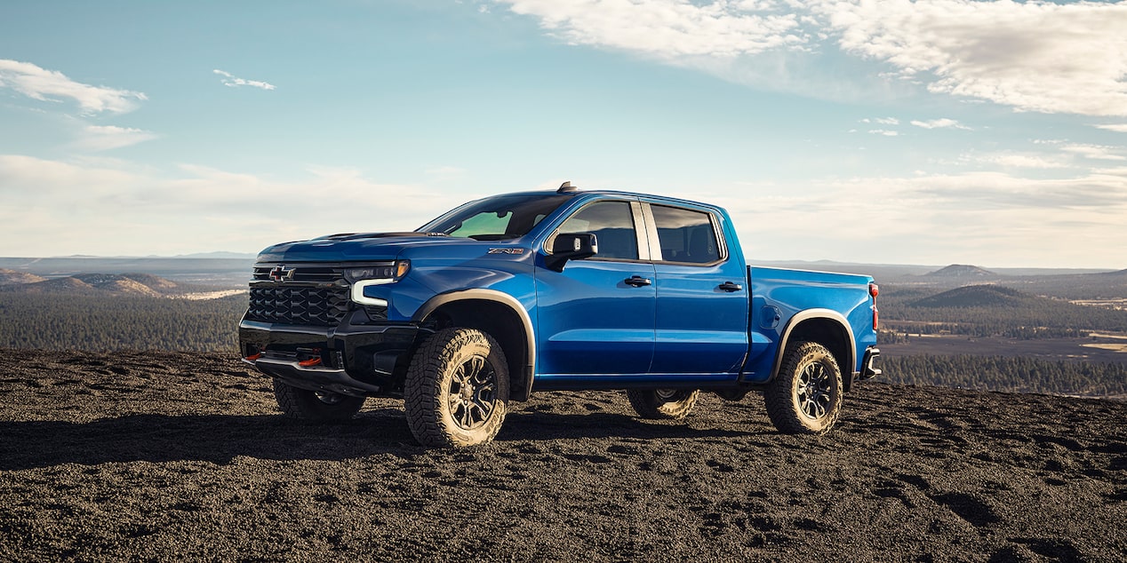 2024 Blue Metallic Silverado ZR2 parked on a gravel