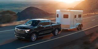 2024 Chevrolet Silverado 1500 Pickup Truck Towing a Trailer