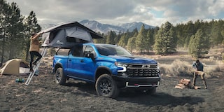 Person Setting up Truck Bed Tent on Chevrolet Silverado 1500