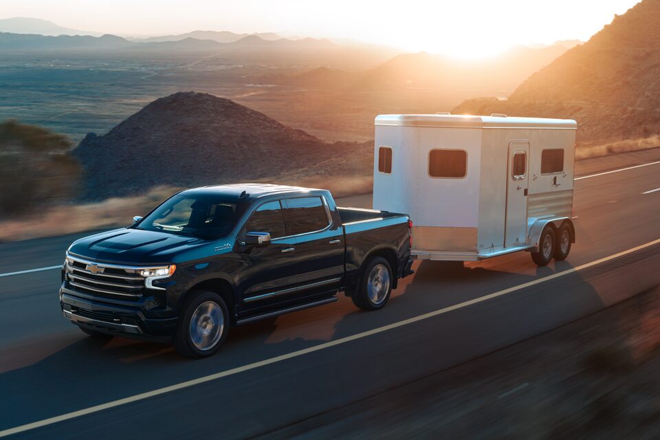 The 2024 Silverado Towing a Trailer on an Open Road