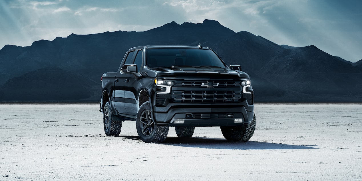 The 2024 Silverado Parked Near the Mountains on a Snow Covered Ground