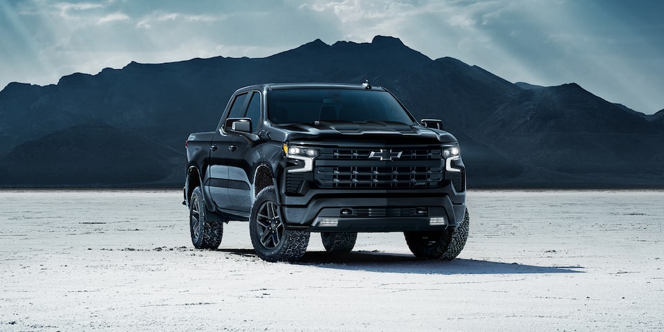 The 2024 Silverado Parked Near the Mountains on a Snow Covered Ground