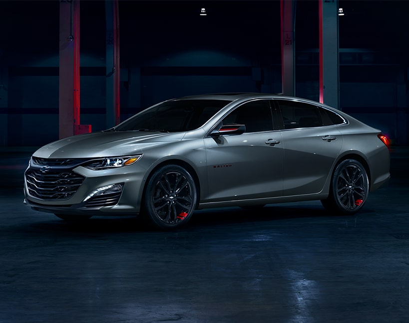 Silver-Colored 2025 Chevy Malibu in a Darkly Lit Environment