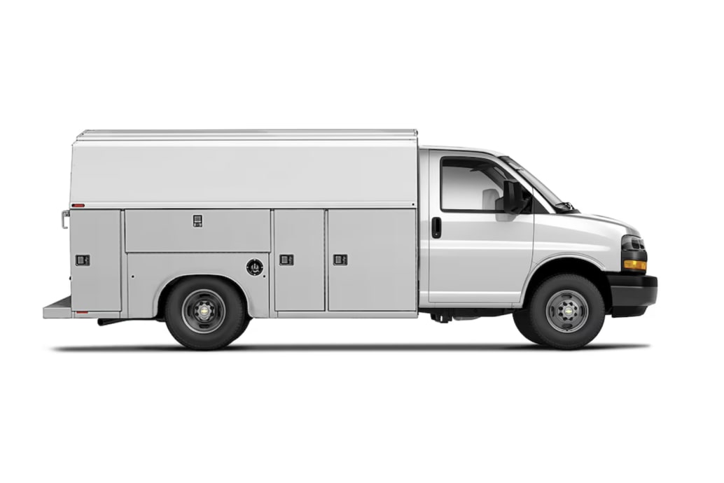 A White Chevrolet Express Cutaway Service Body Truck with a High Utility Bed and Multiple Compartments.