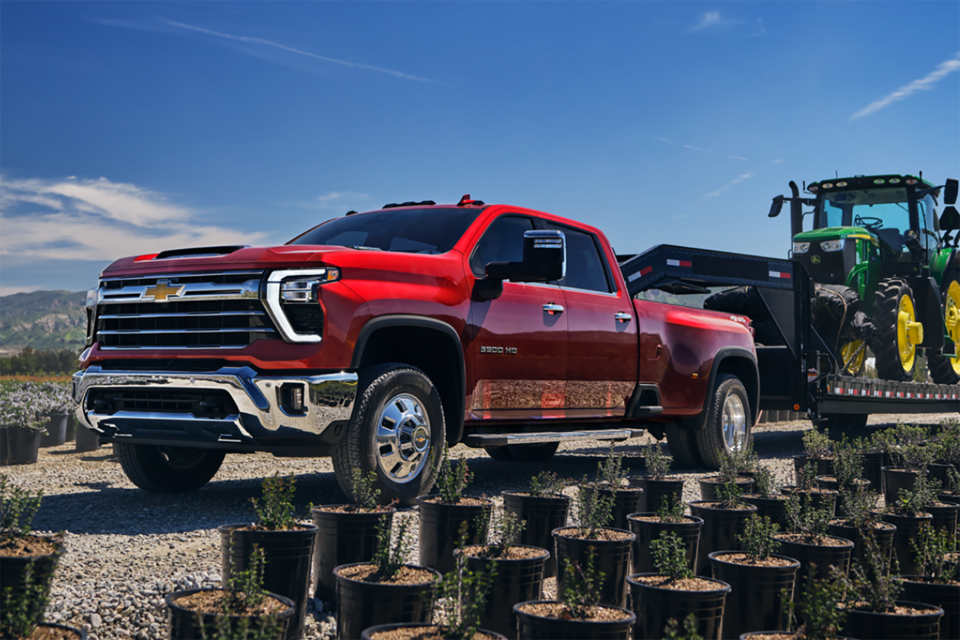 Three Quarters View of a Red Silverado HD Truck under a Clear Blue Sky