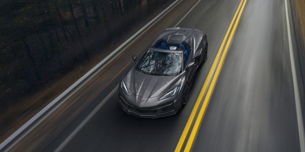 Overhead View of a 2025 Gray Chevy Corvette E-Ray Driving Down the Road 