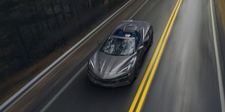 Overhead View of a 2025 Gray Chevy Corvette E-Ray Driving Down the Road
