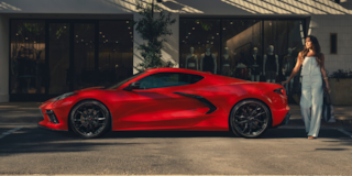 Side View of a 2025 Red Stingray on a Shade with a Girl behind It