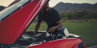Man Looking Under the Hood of the 2025 Corvette Stingray
