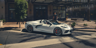 2025 Corvette Stingray Convertible Parked In Front of a Shop