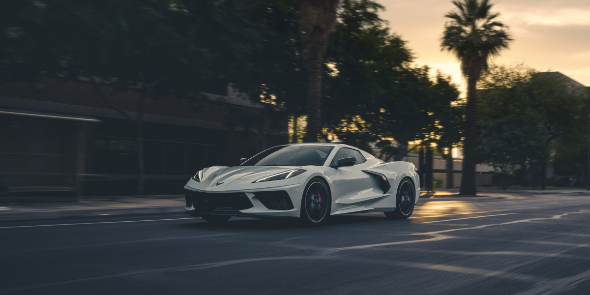 White 2025 Chevrolet Stingray Driving Downtown
