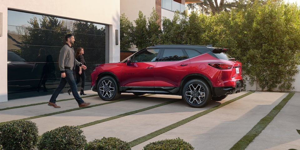 A Couple Walking to Their 2025 Blazer Parked in the Driveway