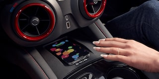 Woman Using Wireless Smart Phone Charging Inside the 2025 Chevy Blazer