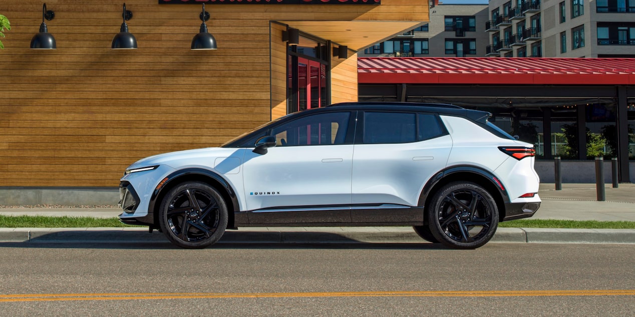 Side View of a White 2025 Chevy Equinox EV Parked by the Side of the Road