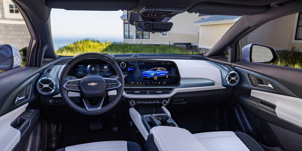 Front Interior View of a 2025 Chevy Equinox EV in Front of a Building