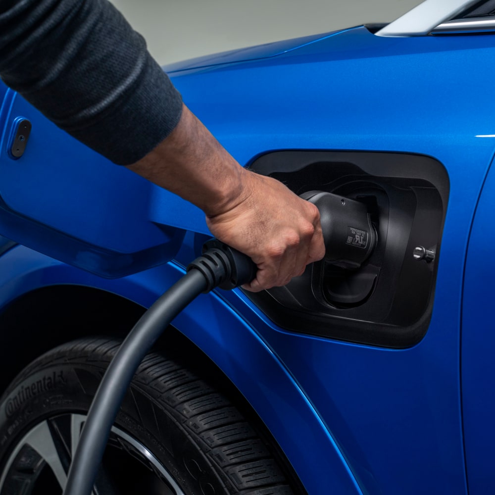 A Blue 2025 Chevy Equinox EV Is Getting Charged