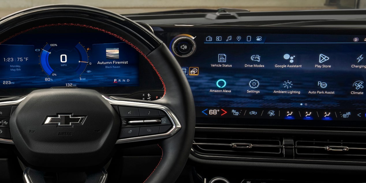 Driver’s Seat View of a 2025 Chevy Equinox EV Steering Wheel and Dashboard Menu