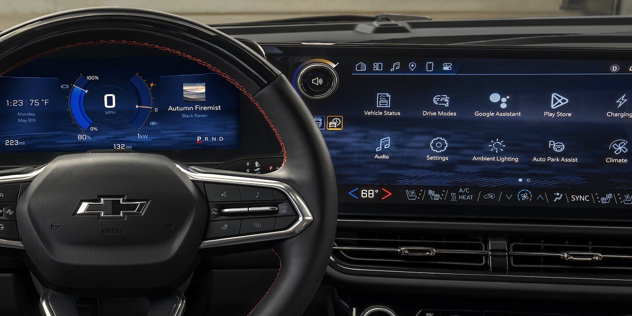 Driver’s Seat View of a 2025 Chevy Equinox EV Steering Wheel and Dashboard Menu