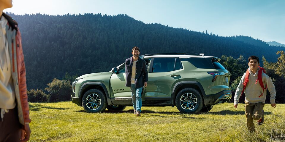 Family in Front of their 2025 Chevy Equinox, Starting Adventure