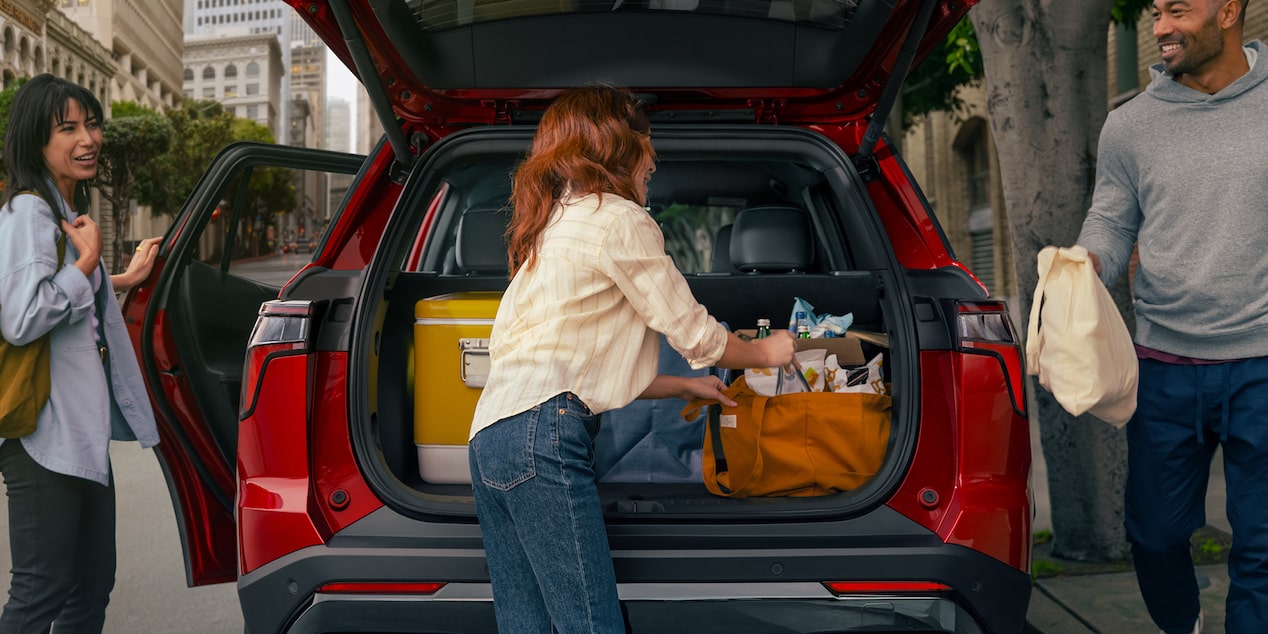 People Unloading Generous Cargo Space in Back of 2025 Chevy Equinox