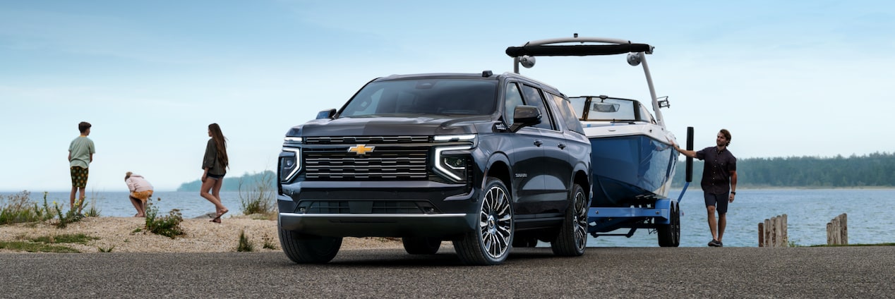A 2025 Chevy Suburban Launching a Speed Boat at a Boat Launch