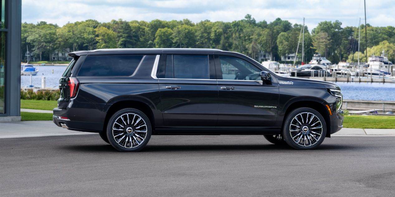 Side View of the 2025 Chevrolet Suburban Parked near a Boat Dock