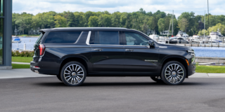 Side View of the 2025 Chevrolet Suburban Parked near a Boat Dock