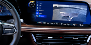 Close-up of the 2025 Chevy Suburban Infotainment System Displaying the Rear End Camera While Towing