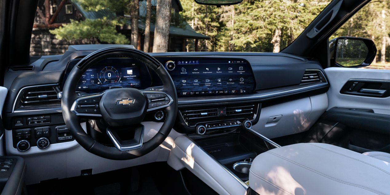 Driver's View of the Front Dashboard, Steering Wheel, and Infotainment System in the 2025 Chevrolet Suburban SUV