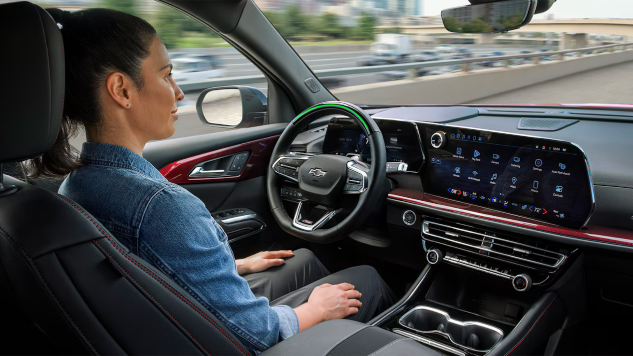 A Woman Sitting in Drivers Seat of a Chevy Traverse SUV Using the Super Cruise Feature