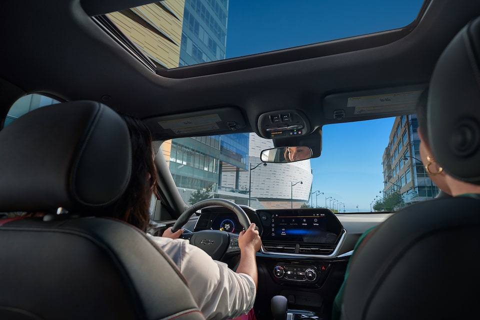 Woman driving her Chevy Trax to Shea Chevrolet's Service Center