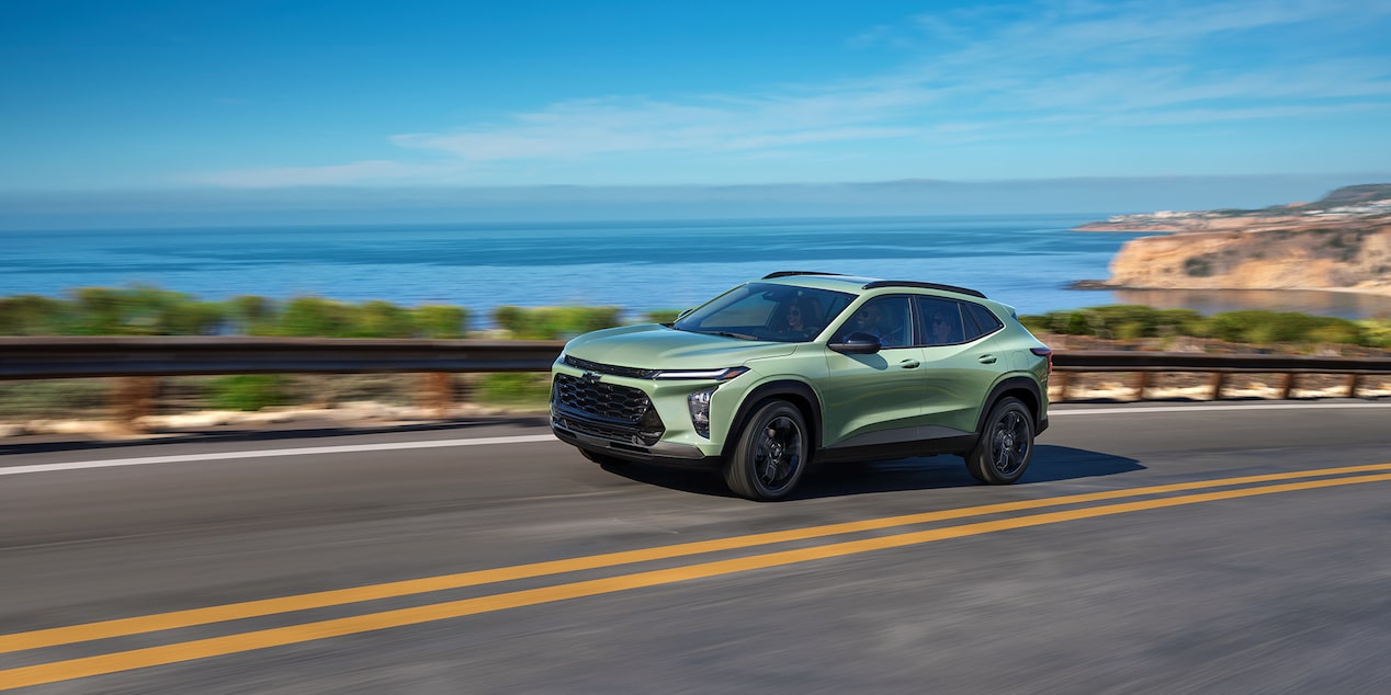  Chevy 2025 Trax Driving Swiftly on Waterfront Road