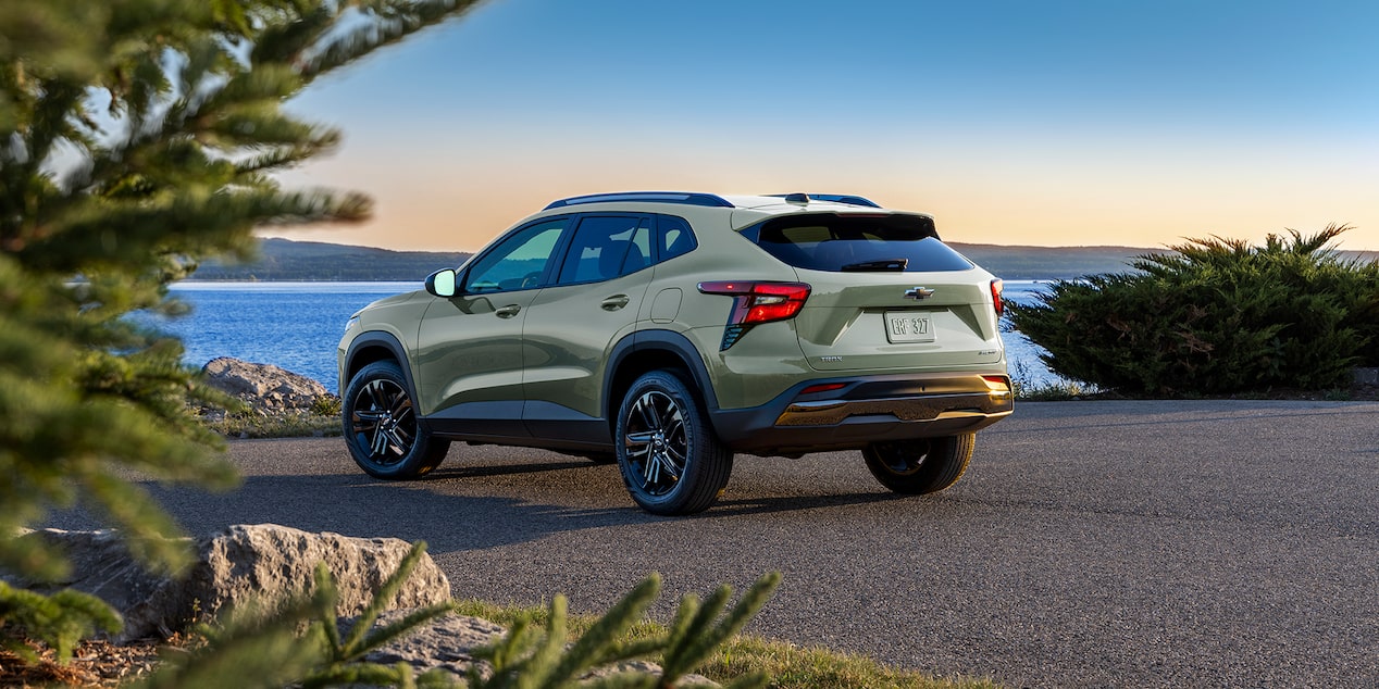 Chevy 2025 Trax Parked Facing a Lake at Sunset