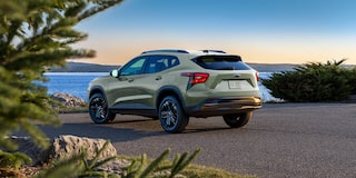 Chevy 2025 Trax Parked Facing a Lake at Sunset