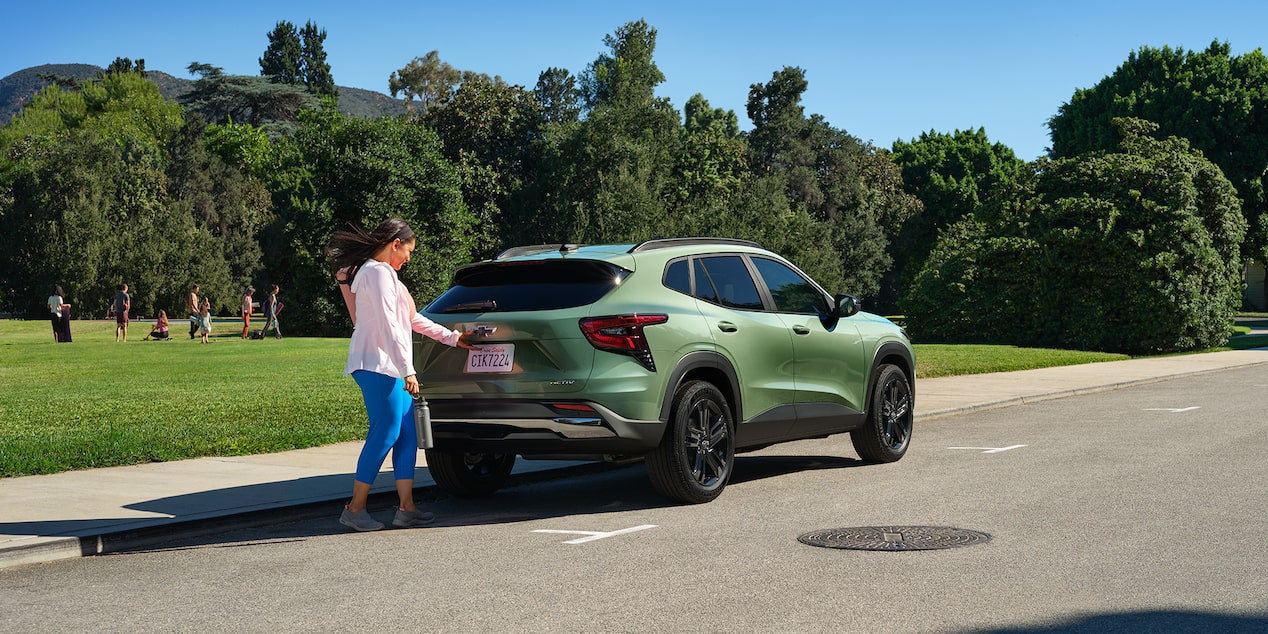 A Woman Opening Her Trunk on the Chevy 2025 Trax