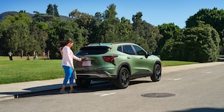 A Woman Opening Her Trunk on the Chevy 2025 Trax
