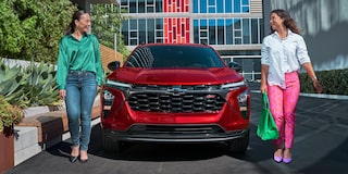 Two Women Walking Away From a  2025 Chevy Trax