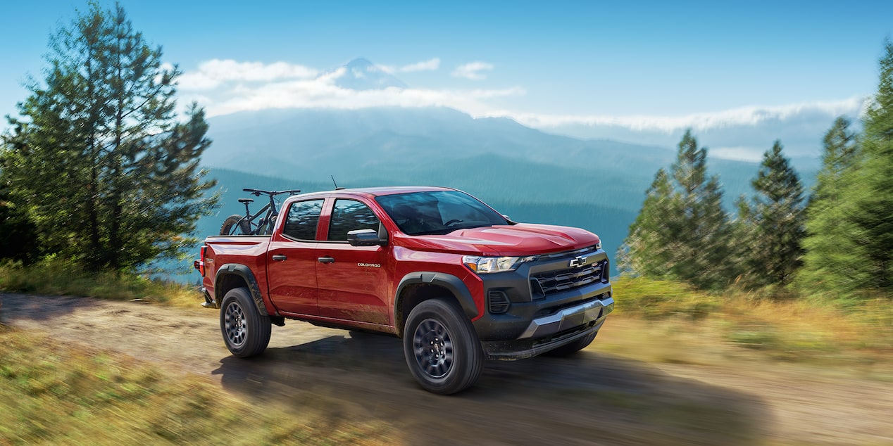 The 2025 Chevy Colorado Driving up a Cliff Side on a Beautiful Day