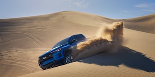 The Chevy Colorado Driving Over Steep Sand Dunes