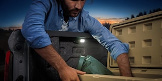 A Colorado Owner Uses the Built-In Tail Gate Lights to Look Through his Cargo at Night