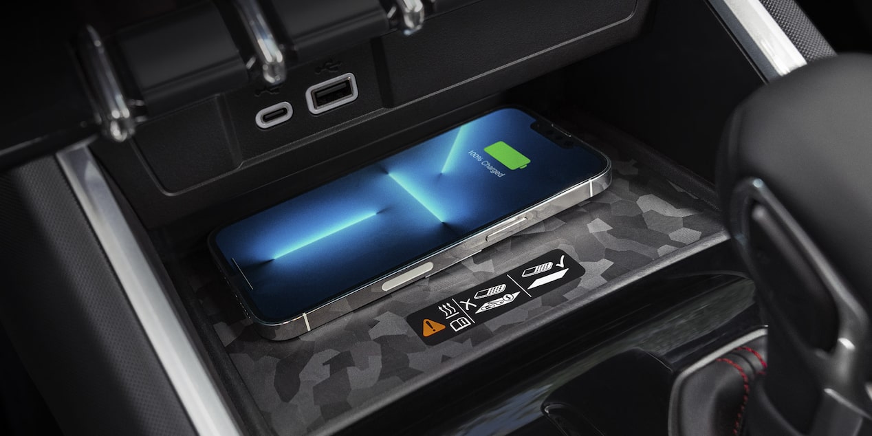 Close-up of an iPhone Charging on a Wireless Charger for a 2025 Chevy Colorado