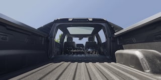 Eye level view of the bed of 2025 Chevy Silverado EV under a sunny day