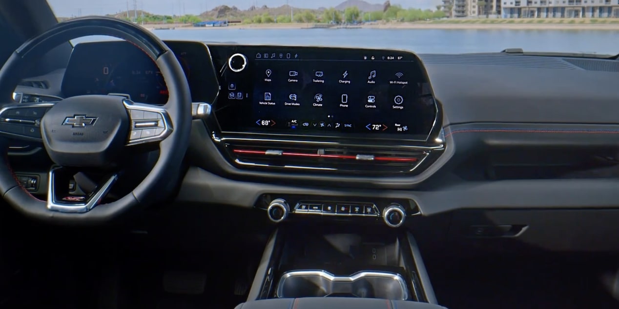 Front interior view of 2025 Chevy Silverado EV under a clear blue sky