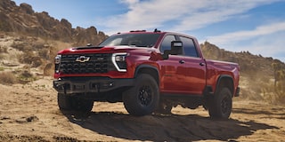 Three Quarters View of a Red 2025 Chevy Silverado HD in a Desert