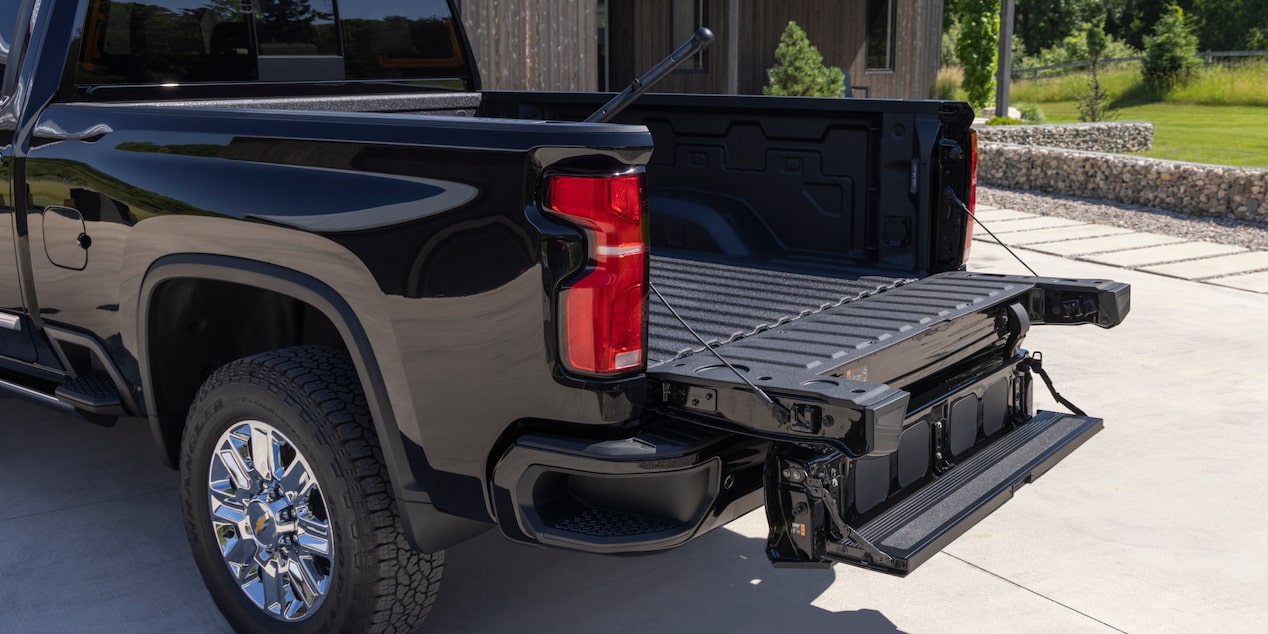 Three Quarters Rear View of a Chevy Silverado HD in Front of a House