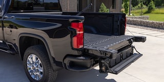 Three Quarters Rear View of a Chevy Silverado HD in Front of a House