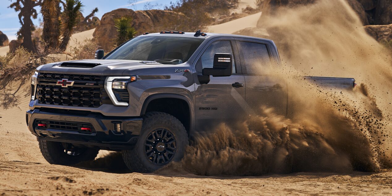 Side View of a 2025 Silverado HD Driving through a Desert
